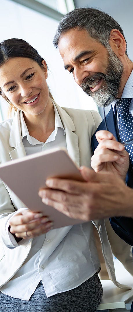 People looking at a tablet