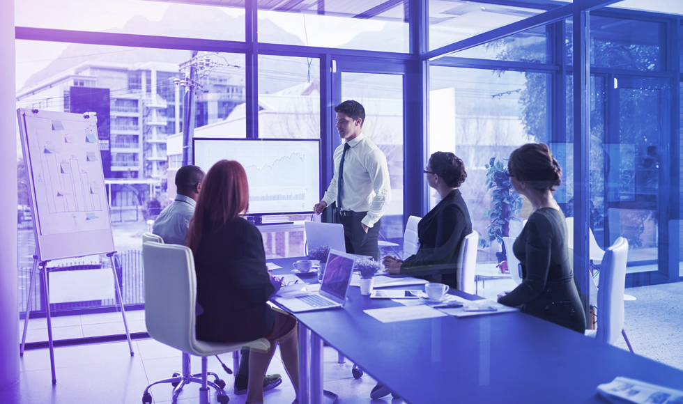 4 people at a conference table